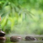 A bamboo fountain and zen stones relaxing clients into guided imagery therapy.