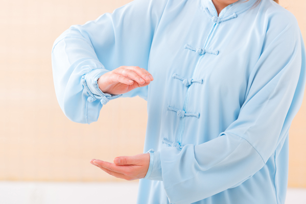 Woman doing qi gong tai chi exercise