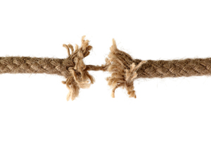 A rope just about to unravel depicting significant psychological stress of victimology