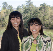 Dr. Ramona Rolle-Berg & Dr. Renee Rolle-Whatley, shoulder-to-shoulder,  smiling