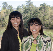 Dr. Ramona Rolle-Berg & Dr. Renee Rolle-Whatley, shoulder-to-shoulder, smiling.